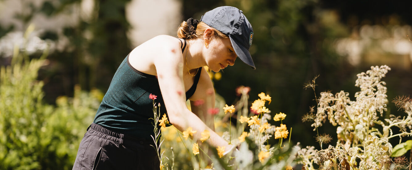 A woman tending to plants.